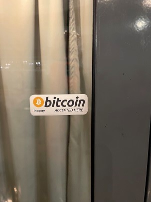 bitcoin sticker on a window